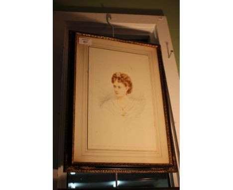 AN EARLY 20TH CENTURY PENCIL AND WATERCOLOUR HEAD AND SHOULDERS PORTRAIT of a young woman with a pink rose in her hair, signe