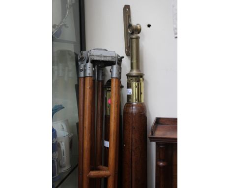 A 19TH CENTURY LARGE MAHOGANY AND BRASS TRIPOD 176cm in length, a similar tripod and an early 20th century tripod (3)