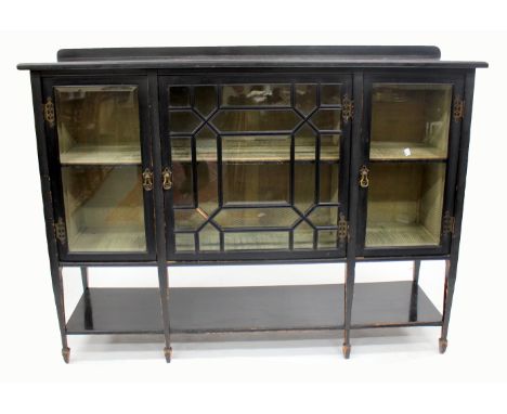 A LATE VICTORIAN BLACK PAINTED GLAZED CABINET with a central astral glazed door to either side with bevelled glass and brass 