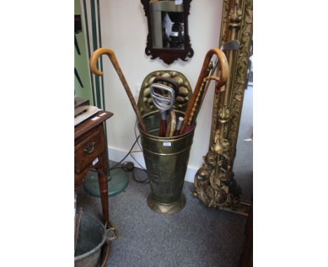 A LATE 19TH / EARLY 20TH CENTURY BRASS STICK STAND with impressed decoration 80cm in height together with various walking sti