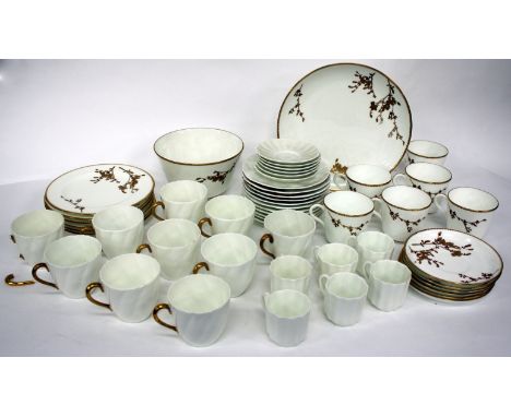 A LATE 19TH CENTURY PORCELAIN PART TEA SERVICE decorated with gilded floral sprigs, together with part Cauldon tea set and a 