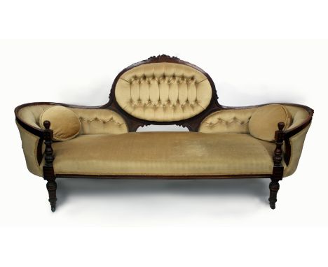 A LARGE LATE 19TH CENTURY WALNUT FRAMED SETTEE with button back upholstery and turned supports, 215cm in length