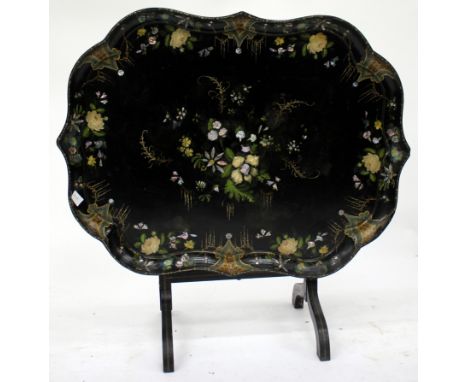 A VICTORIAN B. WALTON & CO. PAPIER MACHE TRAY TOP FOLDING TABLE the shaped top with mother of pearl inlay and hand painted fl