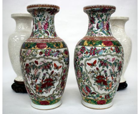 A PAIR OF CHINESE VASES of baluster form painted with birds amongst flowering branches in colours, 36cm high; and two similar