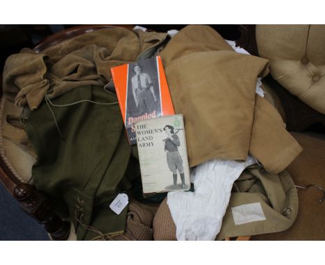 A COLLECTION OF WOMEN'S LAND ARMY CLOTHING to include a pair of 1940's trousers, a Women's Land Army and Timber Corps badge