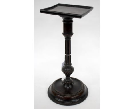 A GEORGE III MAHOGANY TAPER STICK STAND with a square top, a fluted and turned column and a weighted circular base, 31cm in h