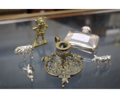 A SMALL SILVER HIP FLASK together with three cast white metal animals, a brass chamber stick and a small brass Bude pixie (6)