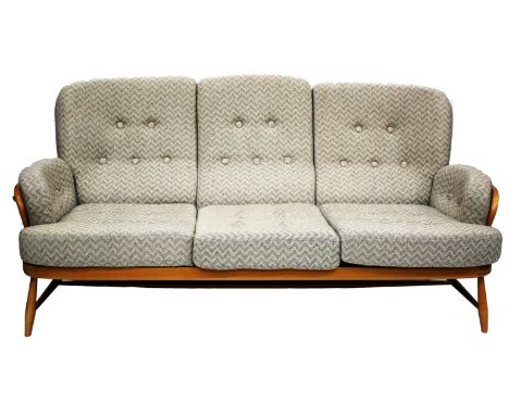 AN ERCOL LIGHT ELM THREE SEATER SETTEE with spindle supports, 190cm wide 