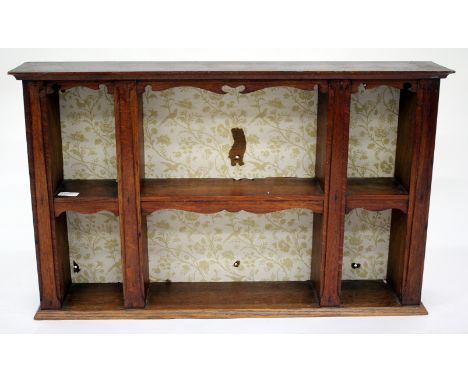 AN ANTIQUE OAK WALL SHELF with fret decoration 80cm wide 