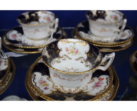 A COALPORT PORCELAIN TEA SERVICE consisting of thirty two pieces with bats wing and gilded decoration