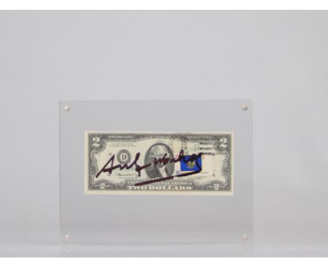 Andy Warhol. 2 dollar bill with the signature of "Andy Warhol" in felt pen. Bears a 13c stamp stuck on the note with the post