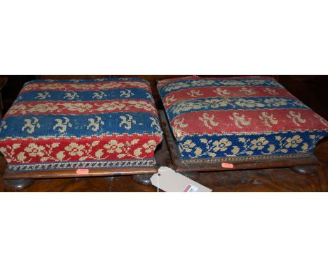 A pair of Victorian rosewood and striped tapestry embroidered upholstered low square section footstools 