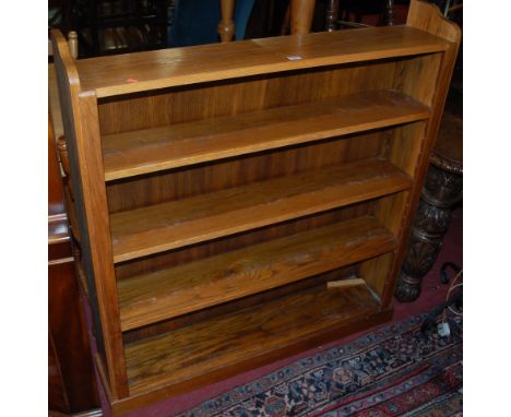 A mid 20th century light oak freestanding open bookshelf