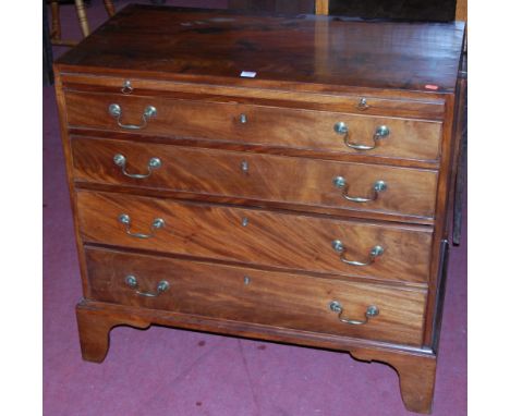 A George III mahogany and crossbanded caddy top chest of four long graduated drawers having upper brushing slide