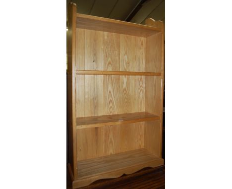 A light oak freestanding open bookshelf