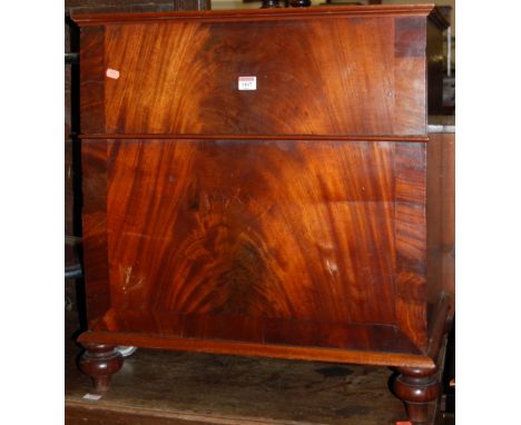 A mahogany hinge top commode