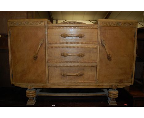 A 1930s light oak ledgeback sideboard 
