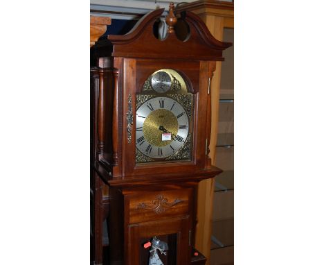 A reproduction German walnut longcase clock, having a three train movement