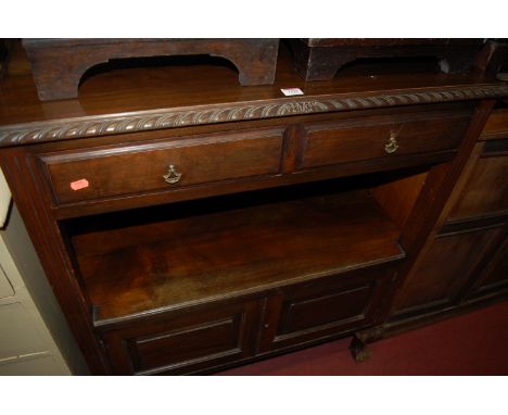 An early 20th century mahogany ledgeback buffet side cupboard having gadrooned edge