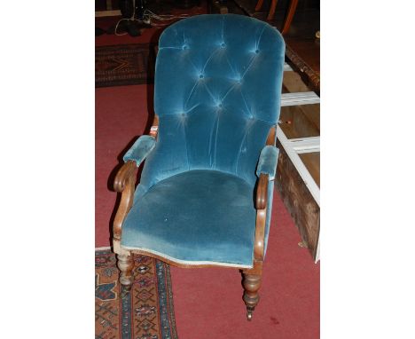 A Victorian mahogany framed and blue button back upholstered open armchair