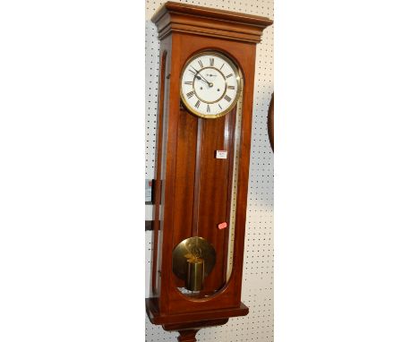 A Victorian and later restored mahogany cased drop trunk wall clock, having single train movement with pendulum