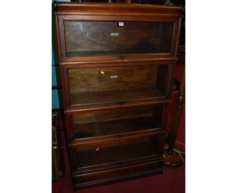 A 1930s Globe Wernicke walnut four tier glazed stacking bookcase 