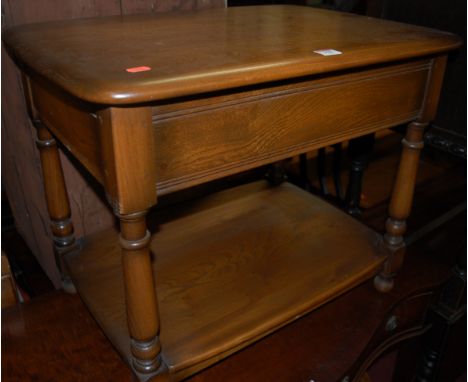 An Ercol mid-elm single drawer two tier low occasional table 