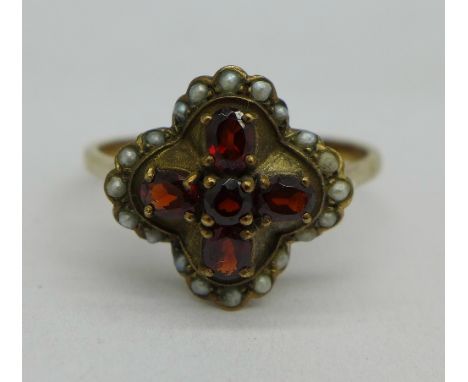 A 9ct gold, garnet and pearl ring, 3.7g, X