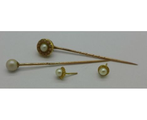 Two stick pins and a pair of earrings