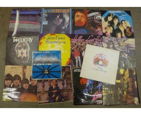 Fourteen LP records, including David Bowie's Ziggy Stardust, Rolling Stones, Beatles For Sale, Rod Steward, Tommy, Otis Reddi