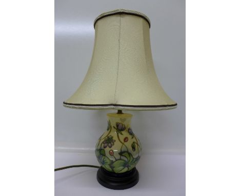 A Moorcroft table lamp base with shade, height of base 19cm