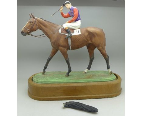 A Royal Worcester model of a racehorse and jockey, The Winner, modelled by Doris Lindner, tail a/f