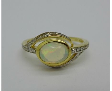 A silver gilt, opal and diamond ring, S