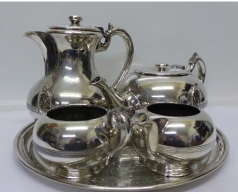 A four piece plated Walker & Hall tea service and plated circular tray