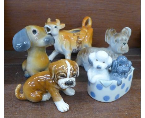 Five figures, including a Goebel boxer puppy and Nao poodles in a basket