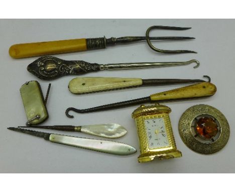 Button hooks, a fork, a miniature clock, etc.
