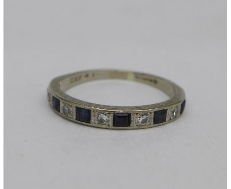 An 18ct white gold, sapphire and diamond ring, 2.9g, P