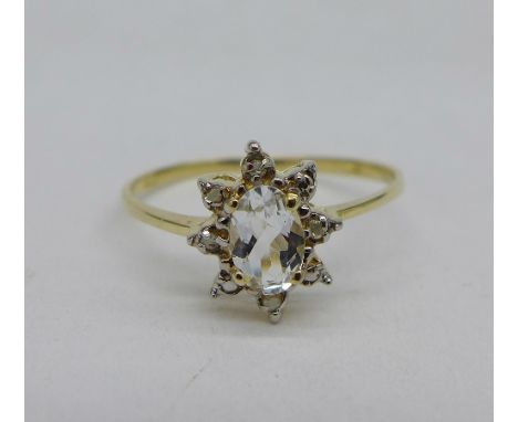 A 9ct gold, topaz and diamond ring, 1.1g, O