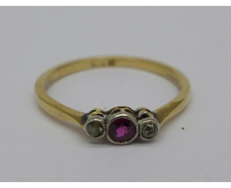 An 18ct gold, three stone ruby and diamond ring, 1.8g, O