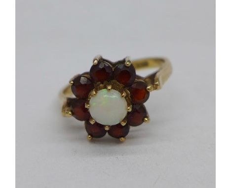 A 9ct gold, opal and garnet cluster ring, 2.3g