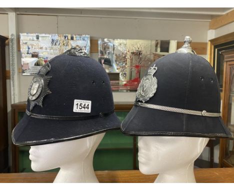 2 vintage police helmets with Lincoln City badges