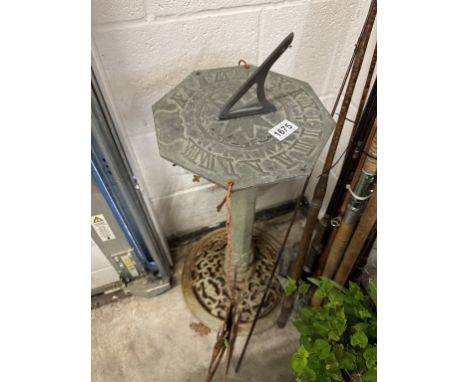 A sundial on cast iron base