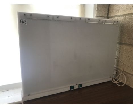 An X-ray light display unitMachine powers up and appears to be working a slight crackling noise can be heard when powered up.