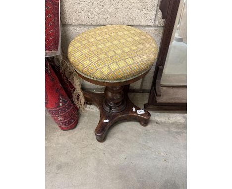 A Victorian mahogany piano stool.