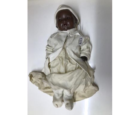 A vintage British made black baby doll (hands a/f).