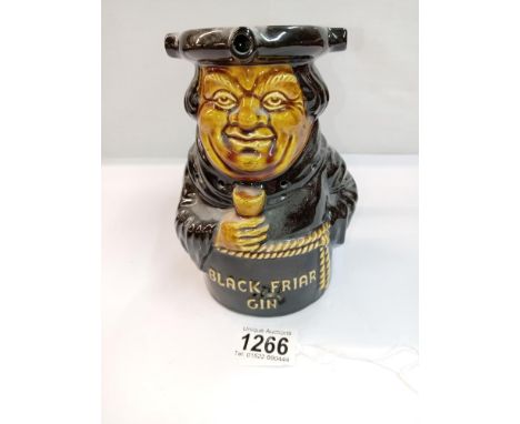 A Dartmouth pottery Black Friar gin Toby puzzle jug. Height 17cm