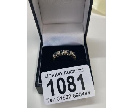 A Diamond and sapphire ring set in 9ct gold size K 1/2