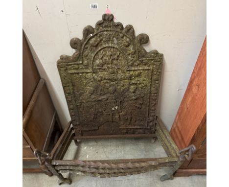 A Georgian cast iron fire dog grate