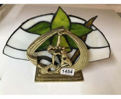 A brass Art Deco style lamp with leaded glass panel