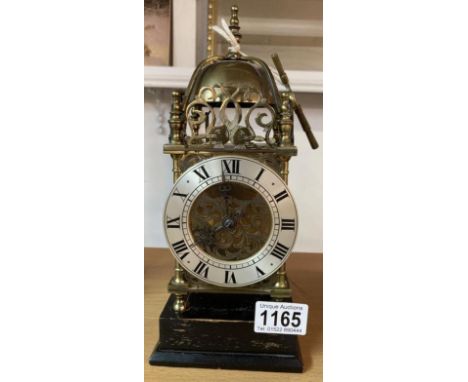 A lantern clock, both springs ok. Chimes in wrong orderHeight 14cm, 93 x 93mm base. Dial D 10cm